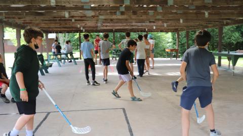 Youth Playing Floor Hockey