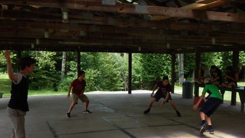 Youth playing a game of 4-square.