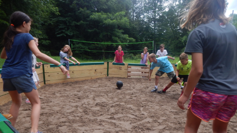 youth playing in the gaga pit.